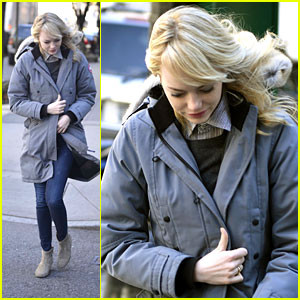 Emma Stone pulls her coat close as she leaves her residence in New ...