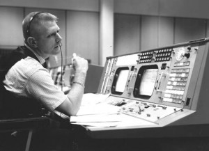 Eugene F. Kranz, flight director, is shown at his console on May 30 ...