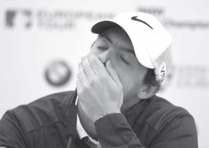 rory mcllroy looks glum at a media conference during the