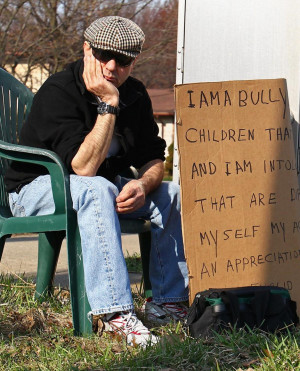 AARON JOSEFCZYK/REUTERS Edmond Aviv, 62, sits with a sign he made as a ...