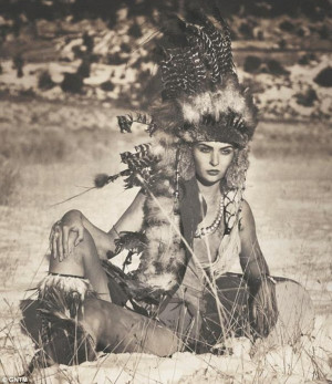 ... models dress up in Native American-inspired outfits and headdresses