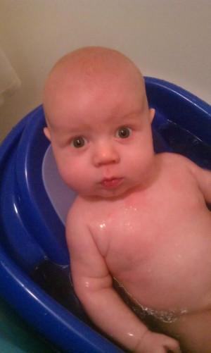 He still loves his bath and is almost too big for the baby tub.