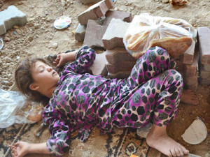 displaced Iraqi Christian child sleeps in Duhok