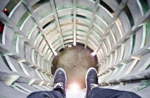 Daredevil photographer takes pictures of his feet dangling off tall ...