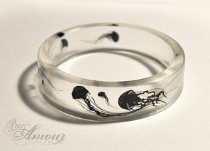 float on - clear resin bangle featuring little jellyfish silhouettes.