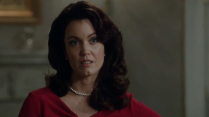 Bellamy Young as Mellie Grant, the wife of President Fritz Grant