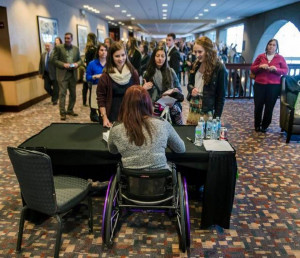 Olympic swimming champion Amy Van Dyken Rouen signs autographs after