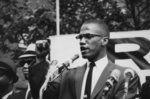 Malcolm X: Malcolm X speaks passionately to a crowd at an outdoor ...