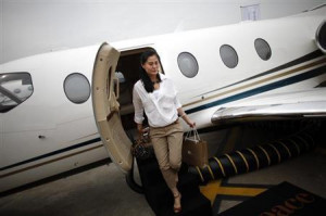 guest descends from a Nextant Aerospace 400XT plane at the Shanghai ...