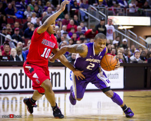 The University of Washington Huskies guard Isaiah Thomas drives to the ...