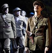 ... in the foreground and cast members of Birdsong (Photo: Johan Persson