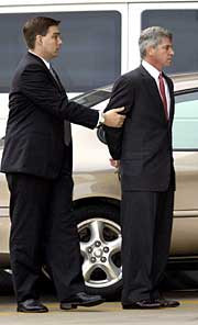 Former Enron finance chief Andrew Fastow is escorted in the custody of ...