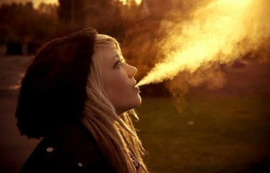 Wallpaper Title: Taking in and blowing out smoke