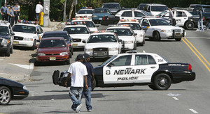 Police cars block the intersection of First Street and Park Avenue to ...