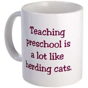 is a lot like herding cats Funny Mug by CafePress: Kitchen & Dining