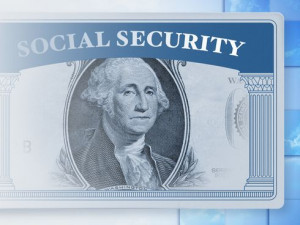 Social security card with dollar bill face / Thinkstock