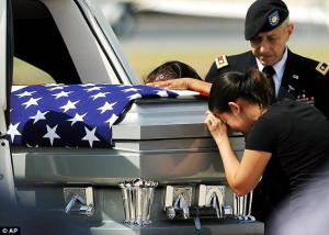 Devastating: Liliana Montenegro cries over the casket of her brother ...