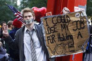 An Occupy Wall Street campaign demonstrator stands in Zuccotti Park ...