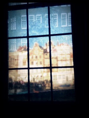 Reflections in the window of the Anne Frank museum. Mobile photography