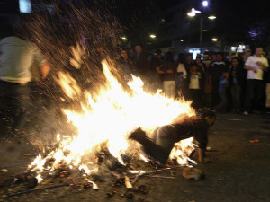 In Ecuador, people burn effigies of their enemies at midnight.