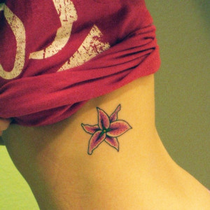 Small Lily Tattoo on Rib for Women