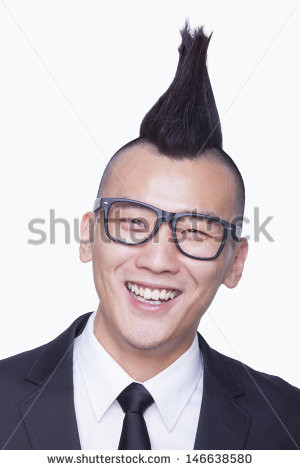 Well-dressed young man with Mohawk portrait - stock photo