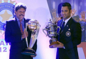 Kapil Dev and MS Dhoni with the exchanged World Cup trophies (2011 and ...
