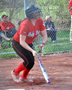 Kourtnie Smith is pictured hitting her double against the Whiteoak ...