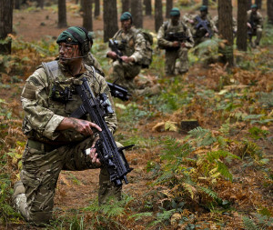Royal Marine Commandos training in the British countryside.