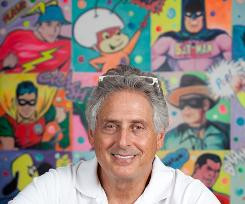 Andy Heyward, CEO of A Squared Entertainment, in front of comic book ...