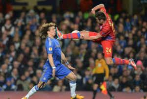 Karate kid: David Luiz tries to avoid the flying boot of Steaua's Raul ...