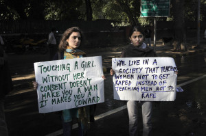 hold placards as they shout anti-government slogans during a protest ...