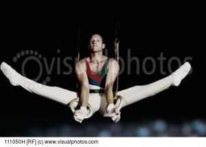 Male Gymnast Performing The