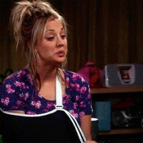 Penny Can’t stop Lauging With a Broken Arm On Big Bang Theory Gif