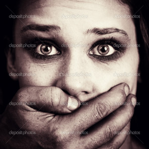 Scared woman victim of domestic torture and abuse - Stock Image