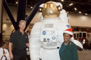 Cosmo stops by for a photo with Doug Peterson and Sheila Jackson Lee.