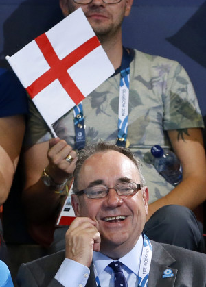 First Minister of Scotland Alex Salmond smiles as he watches a diving