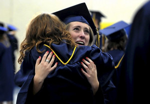 Sierra Swenson, 18, (facing forward) hugs fellow graduate Lainey ...