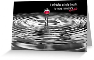 Red rose reflected in water droplet with quote.