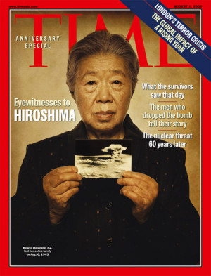 survivor of Hiroshima holds a picture of the mushroom cloud ...