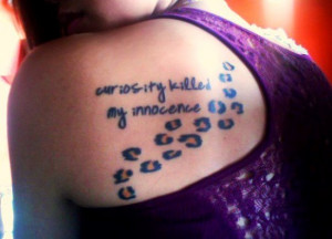 17. Shoulder Blade Leopard Print Tattoo with Quote
