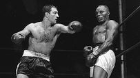 AP Photo Walcott stands stiffly against the ropes as Rocky Marciano ...