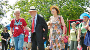 ... procession in 2013, flanked by Nigel Costley and Frances O'Grady