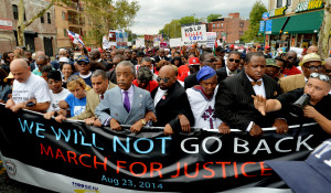 Rev. Al Sharpton (5-L) walks with others during the 'We Will Not Go ...