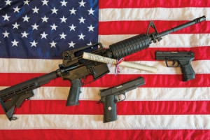 American flag, assault rifle and handguns