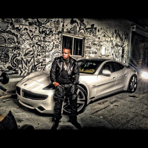 Yo Gotti wearing a Versace jacket with a Versace belt and some Versace ...