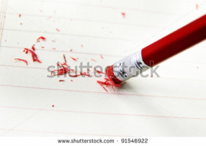closeup of a pencil eraser correcting a mistake - stock photo