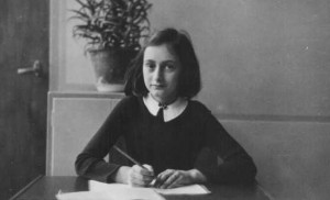 Anne Frank, age twelve, at her school desk. Amsterdam, the Netherlands ...
