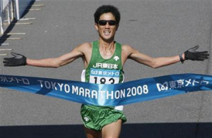 Japan's Arata Fujiwara crosses the finish line to finish second in the ...