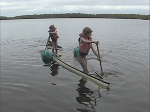 young summer kid happy girl fun female child kayaking kayak canoe